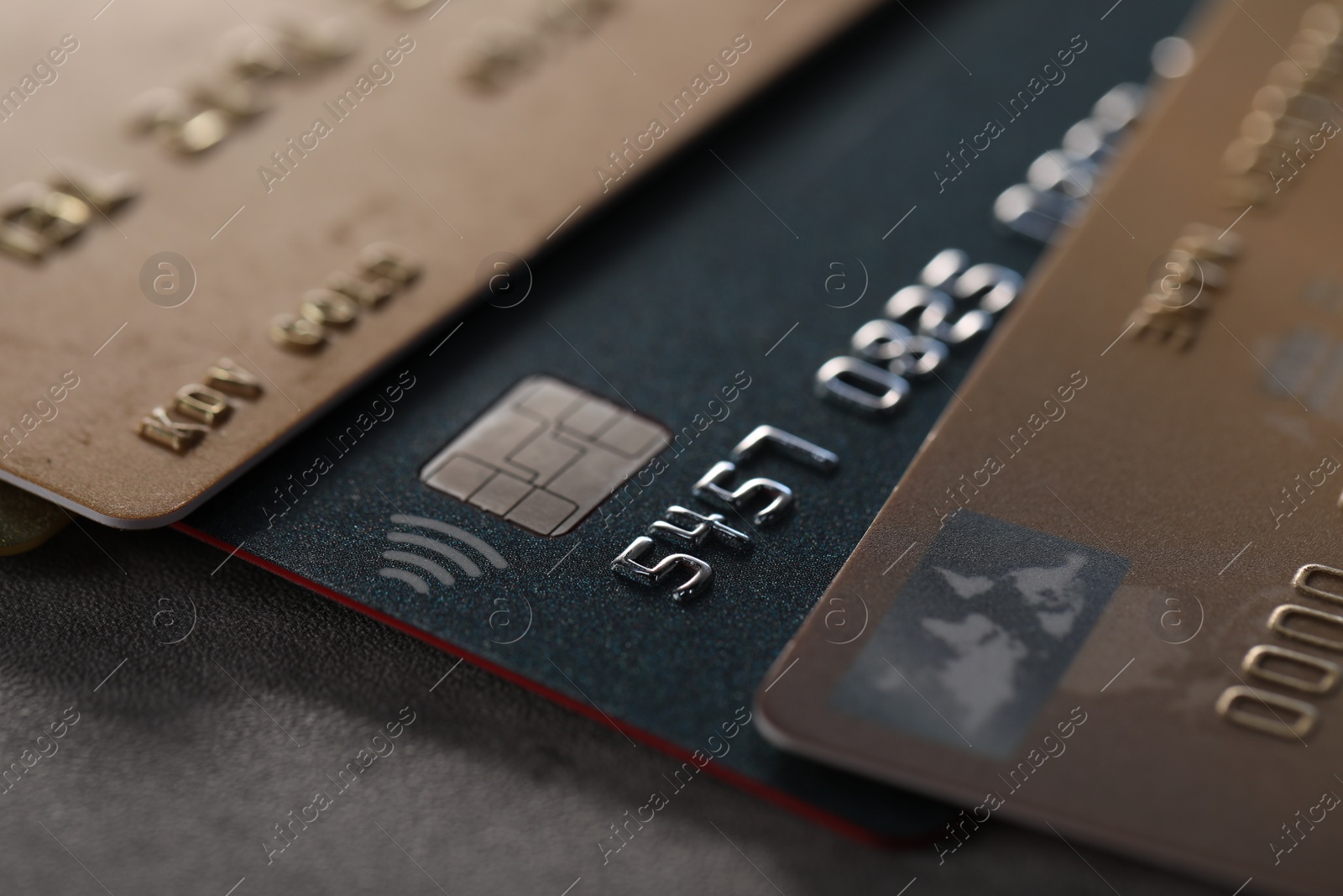 Photo of Plastic credit cards on table, macro view