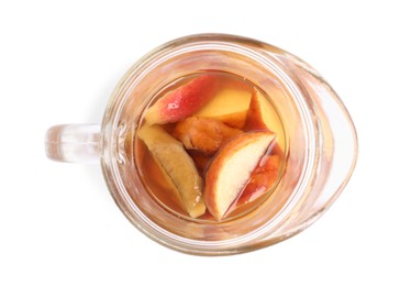 Delicious compot with dried apple slices in glass pitcher on white background, top view