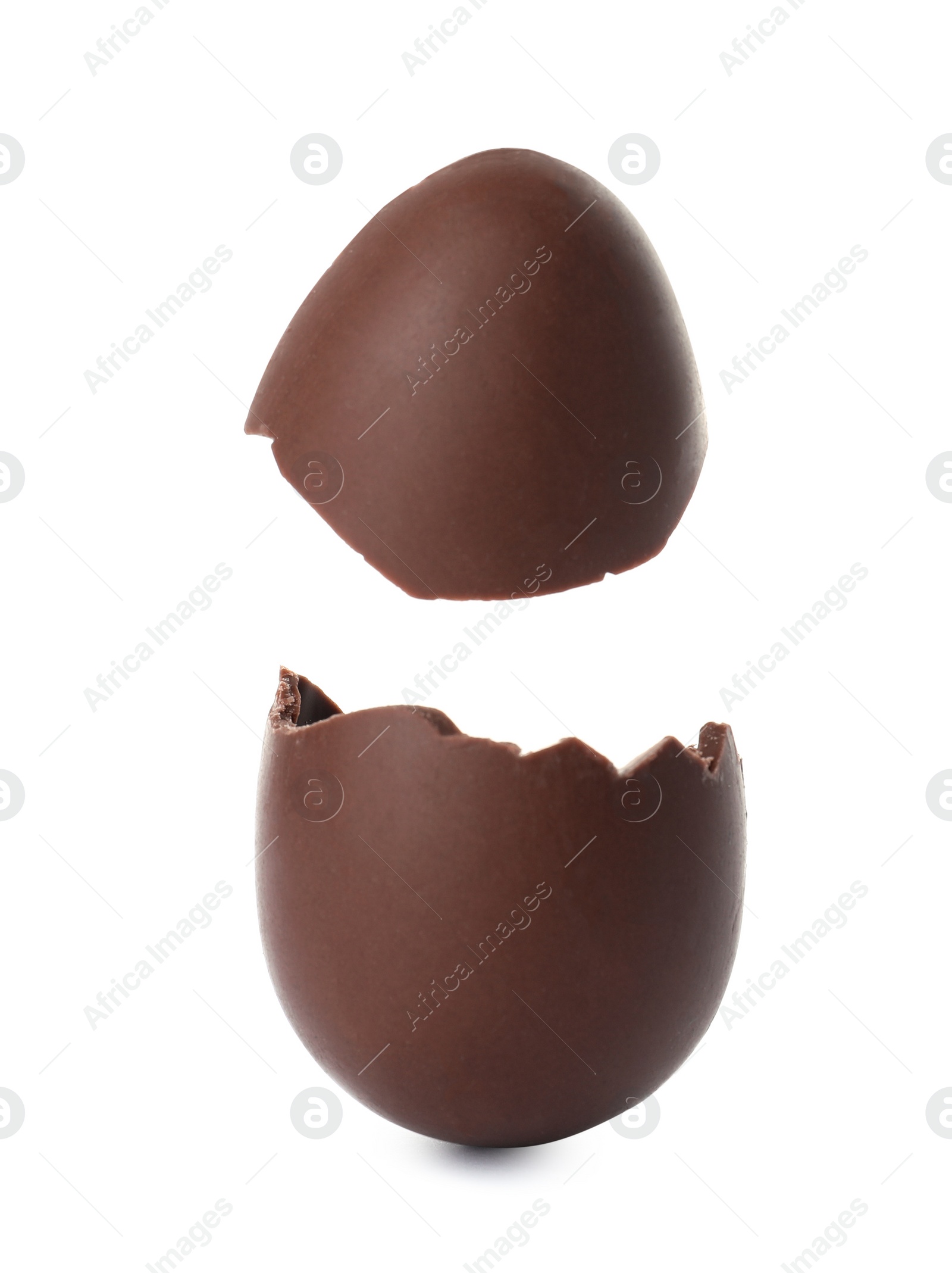 Photo of Cracked chocolate Easter egg on white background