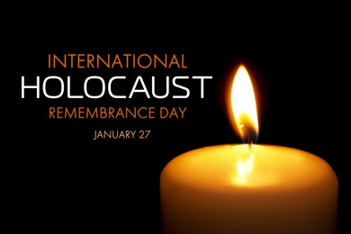 Image of International Holocaust Remembrance Day January 27. Burning candle on black background, closeup 