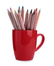 Photo of Colorful pencils in red cup on white background
