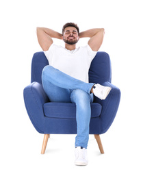 Young man resting in armchair isolated on white