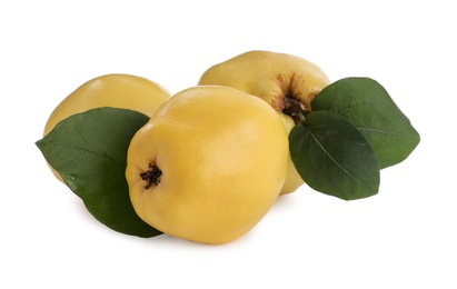 Photo of Ripe quinces with leaves on white background