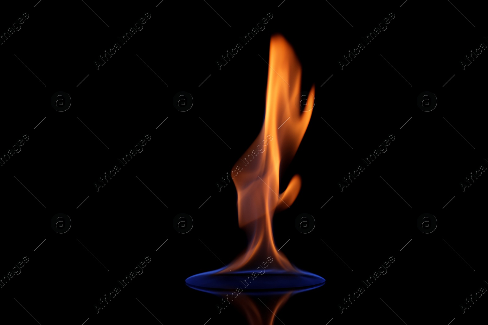 Photo of Beautiful view of flaming vodka on black background