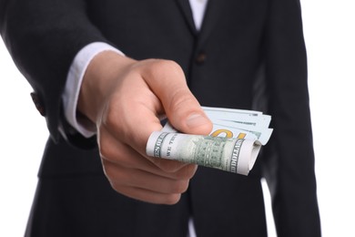 Photo of Money exchange. Man holding dollar banknotes on white background, closeup