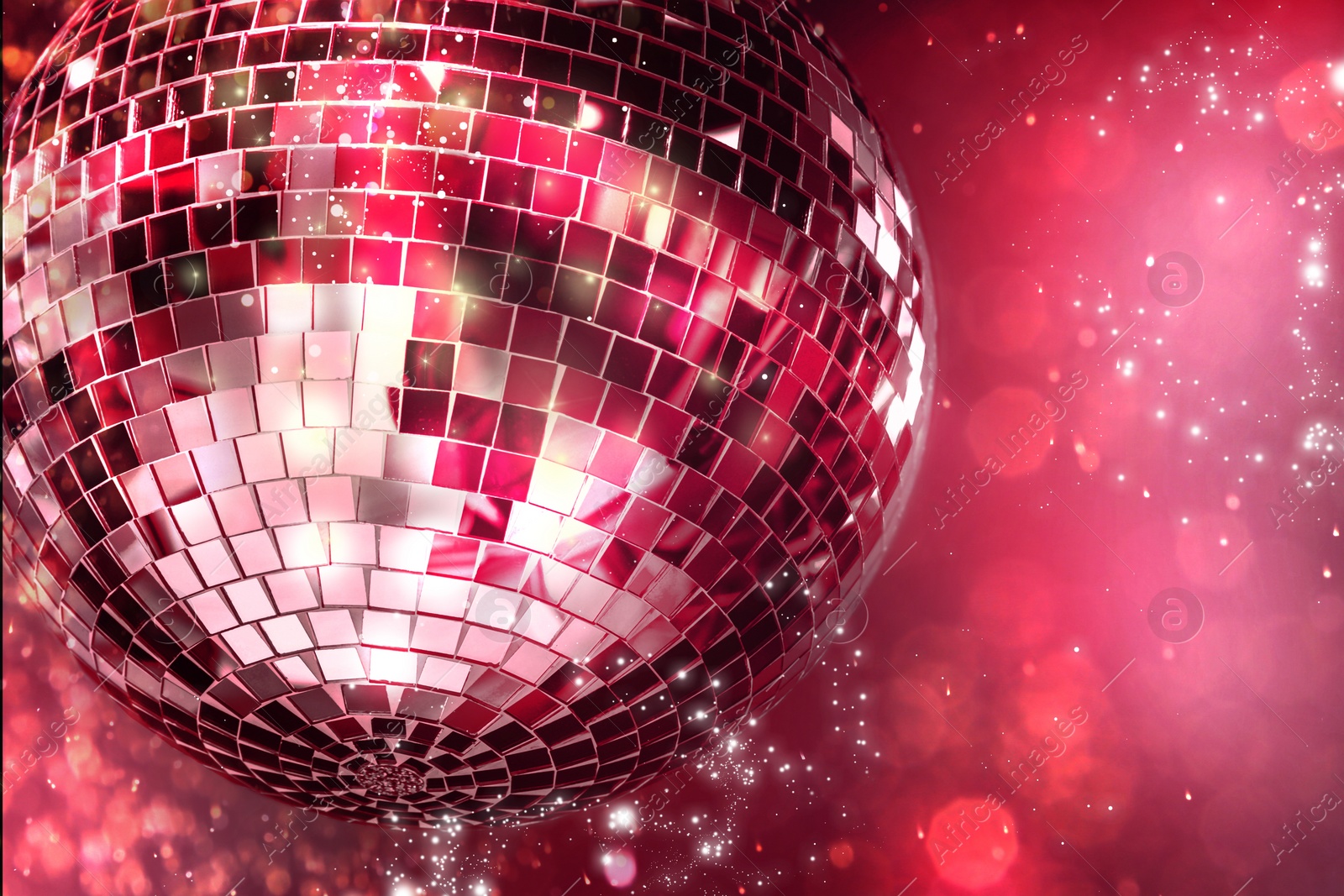 Image of Shiny disco balls on color background with blurred lights, space for text. Bokeh effect