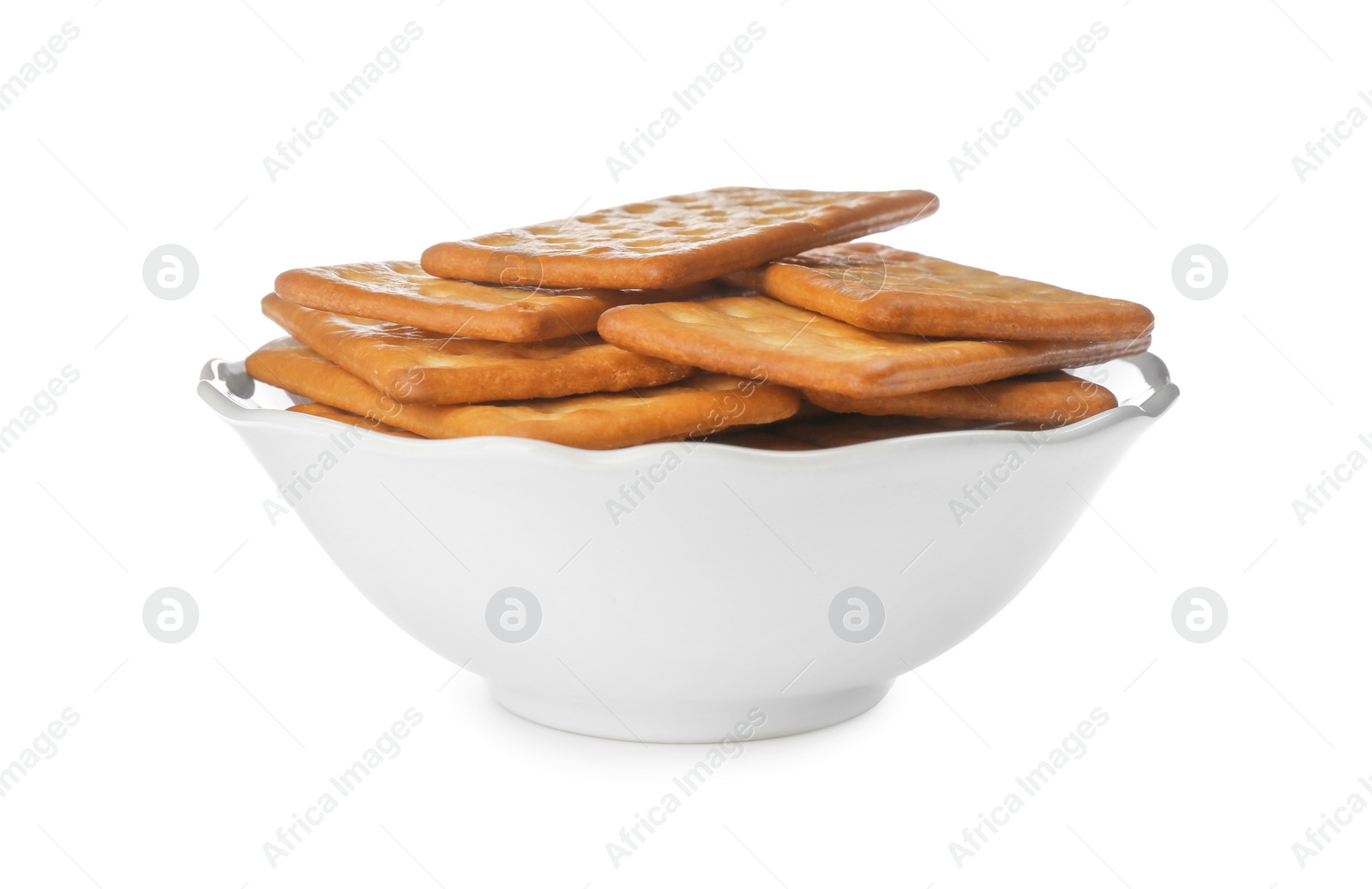 Photo of Delicious crackers in bowl isolated on white