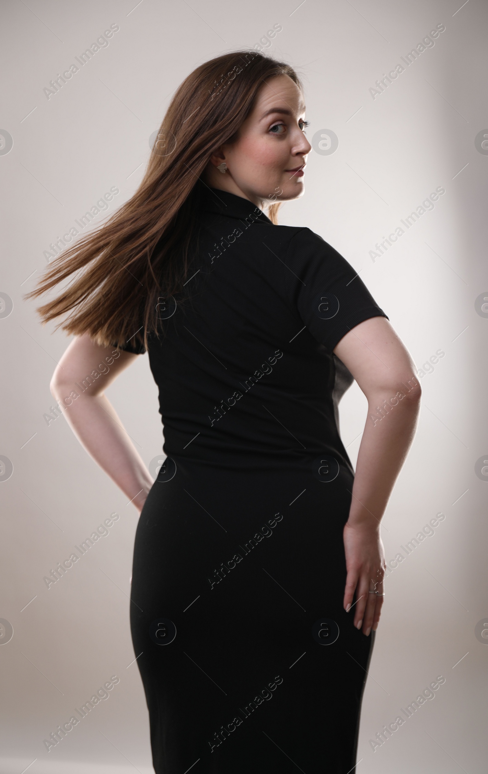 Photo of Portrait of beautiful woman on gray background