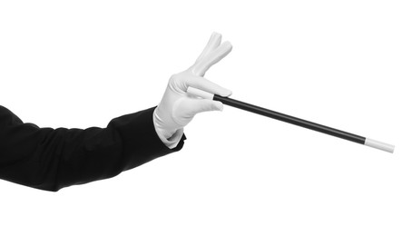 Photo of Magician holding wand on white background, closeup