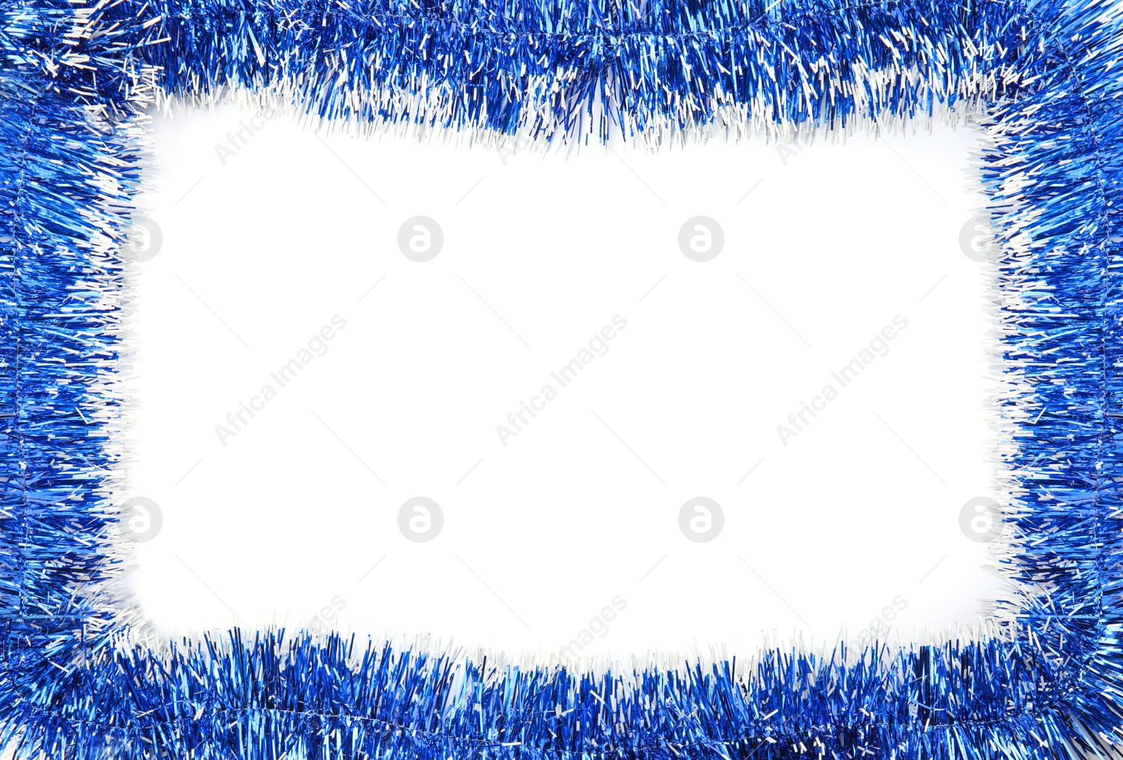 Photo of Frame of shiny blue tinsel on white background, top view. Space for text