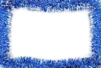Frame of shiny blue tinsel on white background, top view. Space for text
