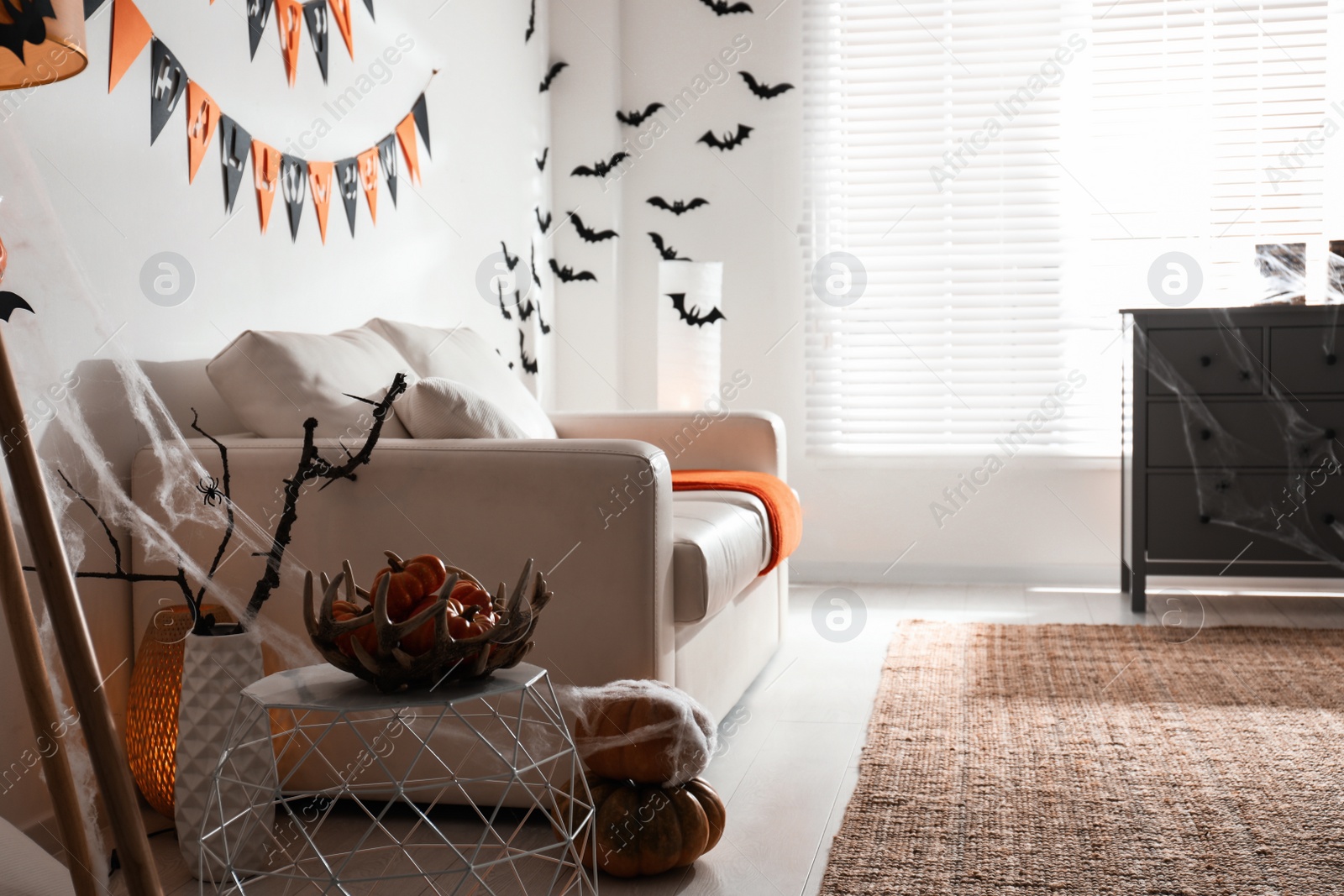 Photo of Modern room decorated for Halloween. Festive interior