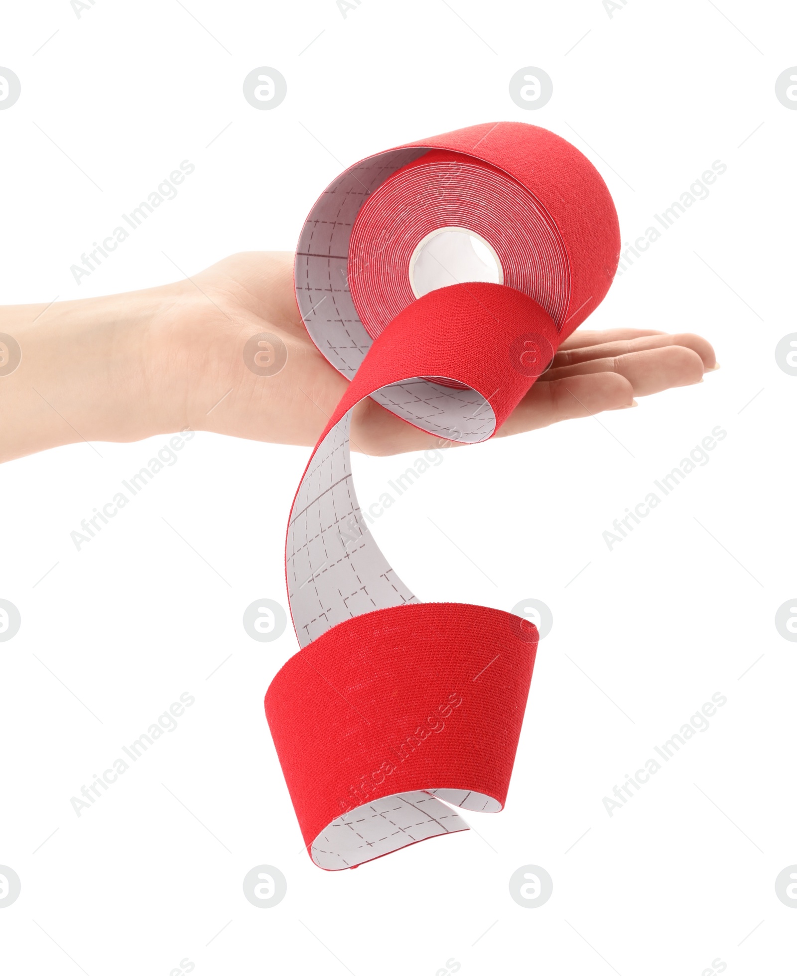 Photo of Woman with bright kinesio tape in roll on white background, closeup