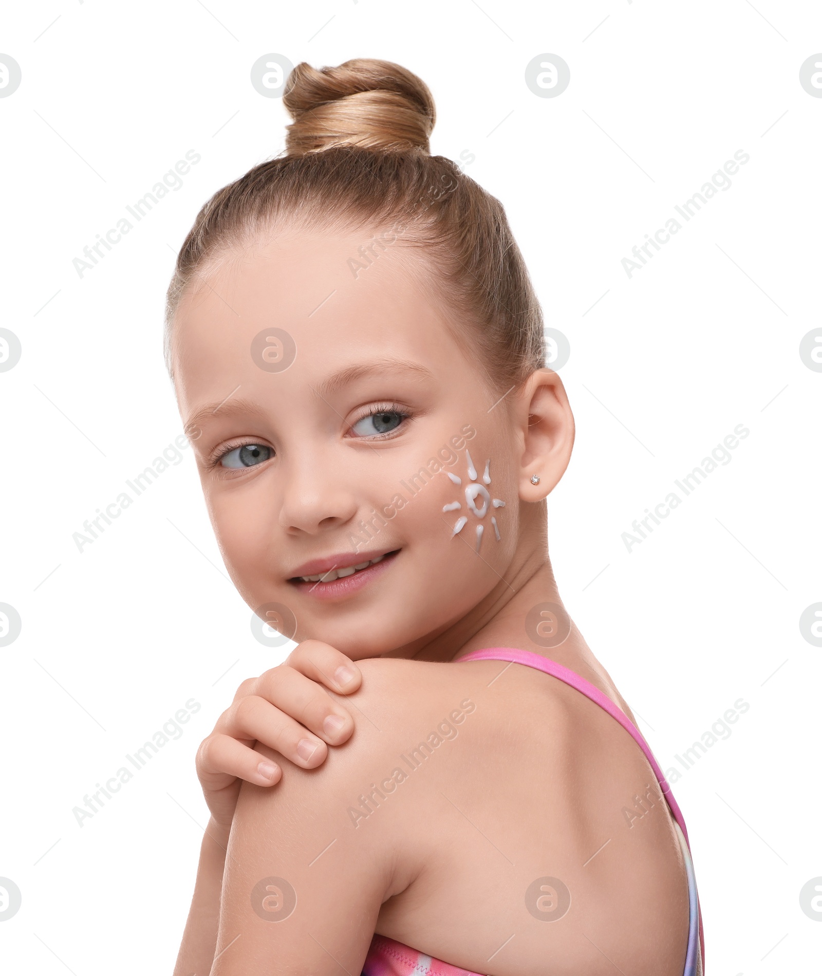 Photo of Happy girl with sun protection cream on her face isolated on white