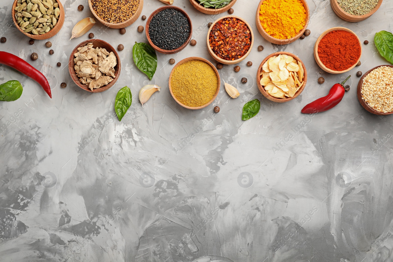 Photo of Flat lay composition with different aromatic spices on grunge background