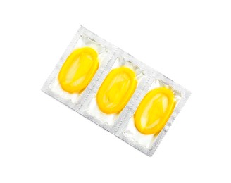 Photo of Condom packages on white background, top view. Safe sex