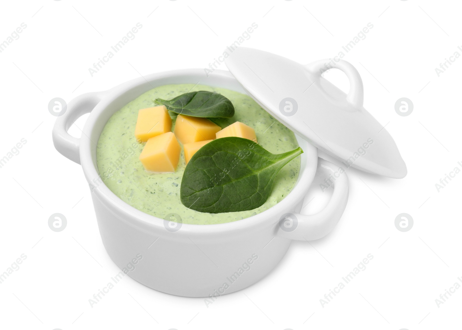 Photo of Delicious spinach cream soup with cheese in bowl isolated on white