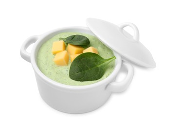 Photo of Delicious spinach cream soup with cheese in bowl isolated on white