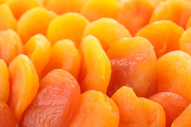 Tasty apricots as background, closeup. Dried fruit as healthy food