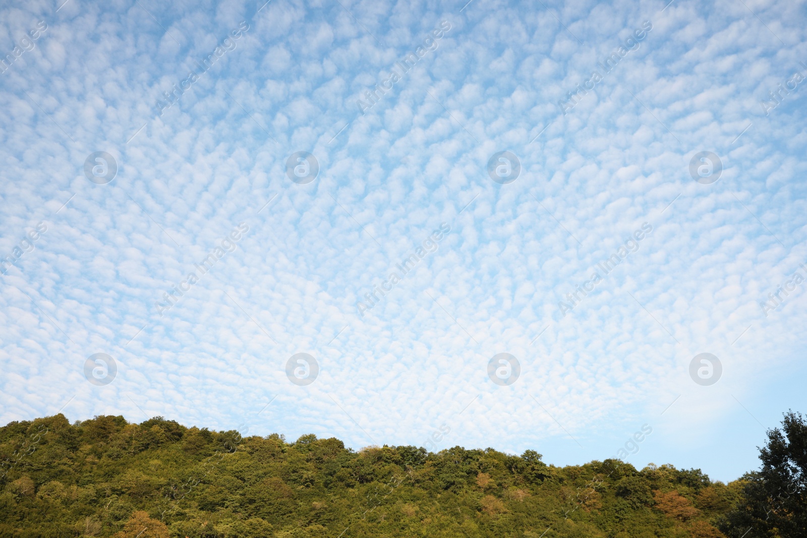 Photo of Beautiful view of blue cloudy sky over hill