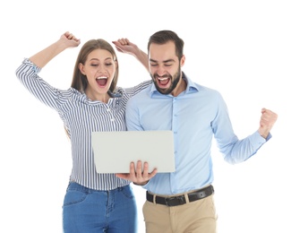 Emotional young people with laptop celebrating victory on white background