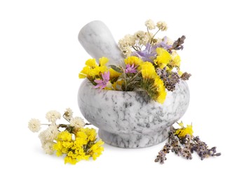 Photo of Marble mortar with different flowers and pestle on white background