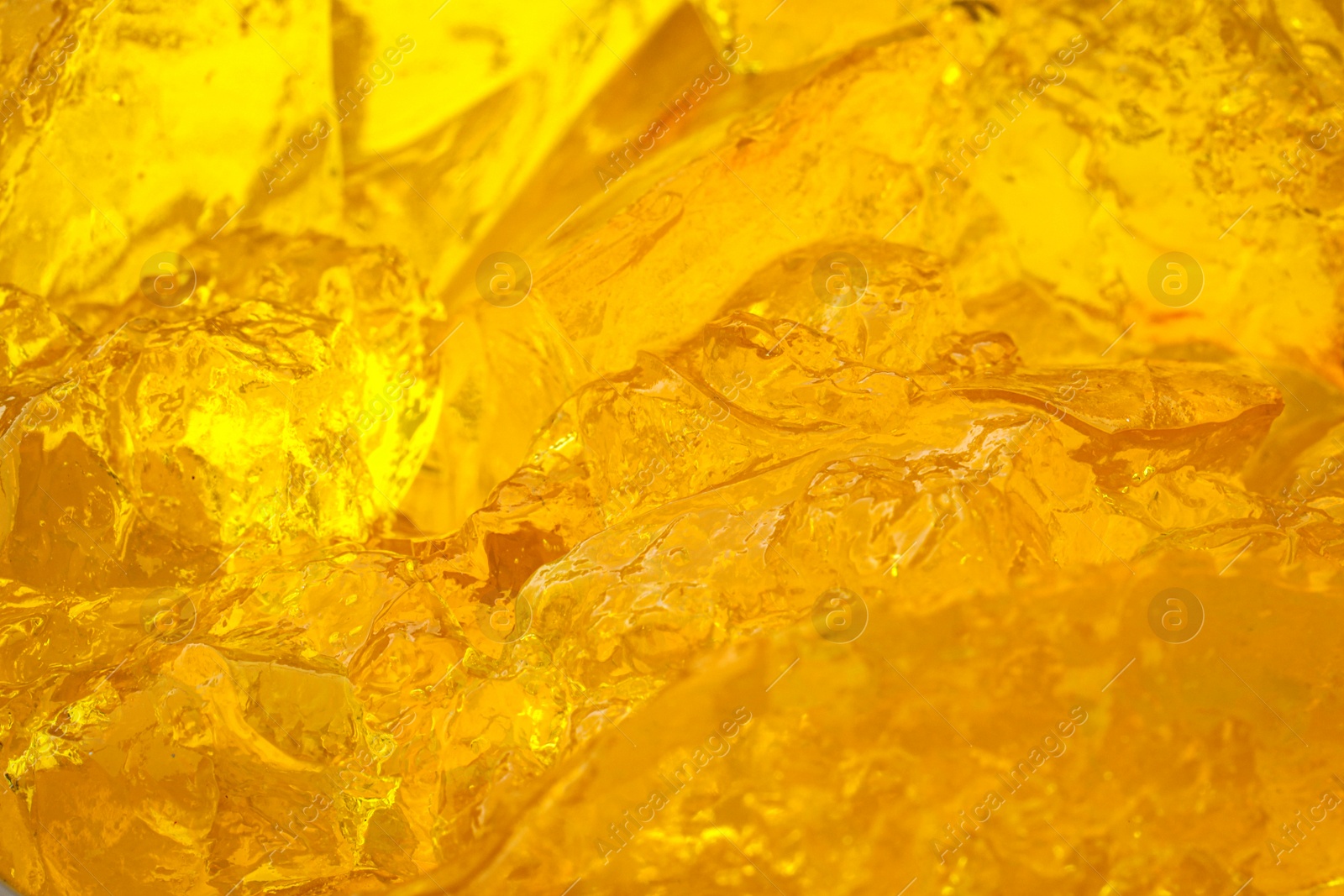 Photo of Delicious yellow fruit jelly as background, closeup