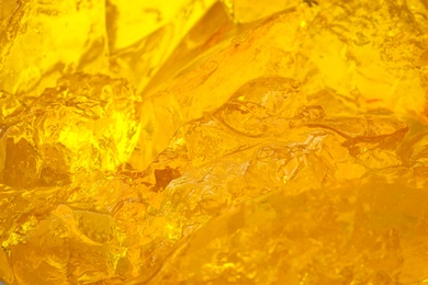 Photo of Delicious yellow fruit jelly as background, closeup