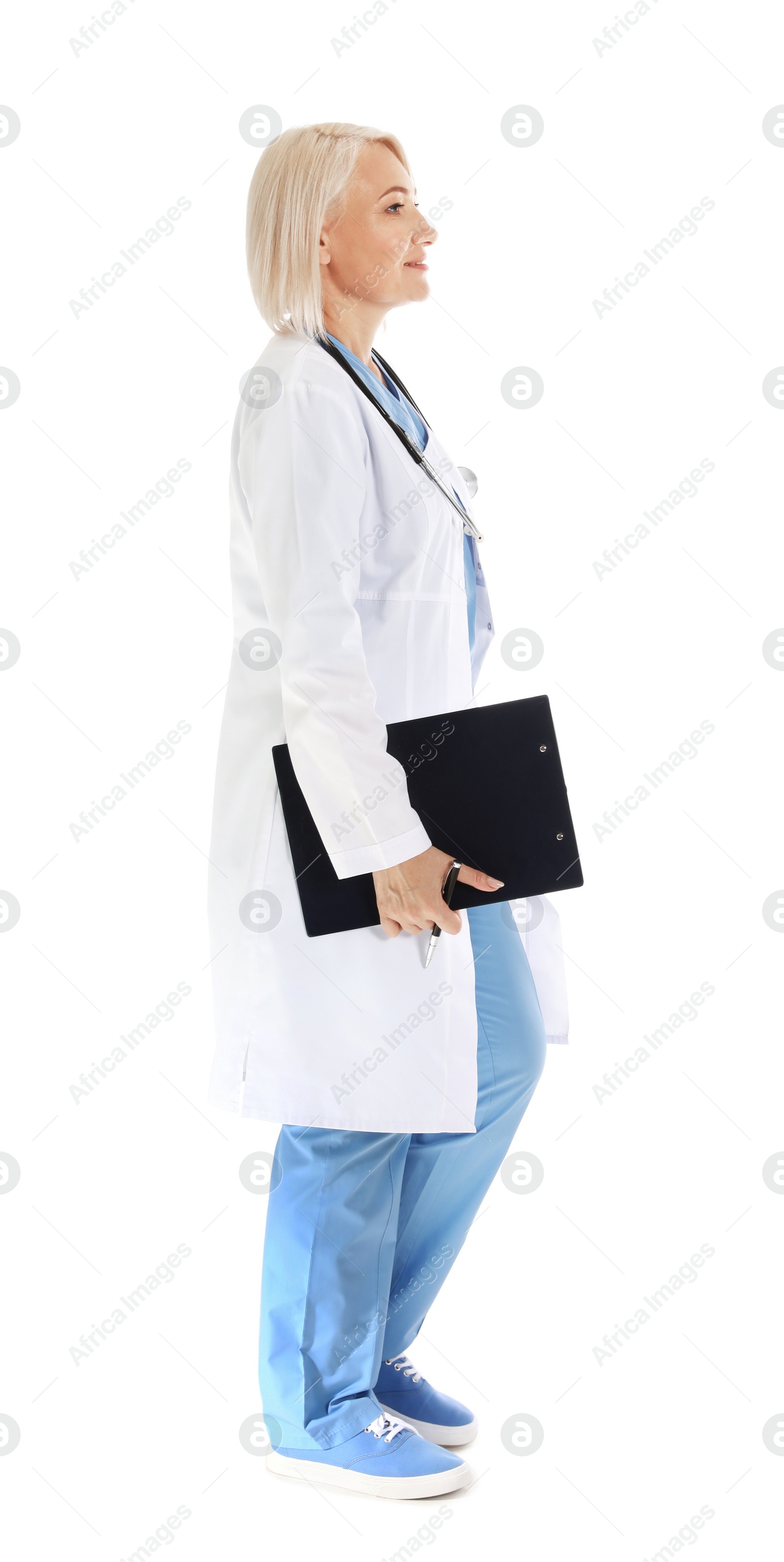 Photo of Full length portrait of female doctor with clipboard isolated on white. Medical staff