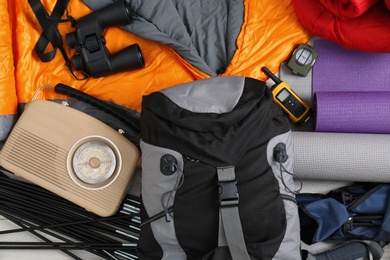 Photo of Composition with sleeping bag and camping equipment as background