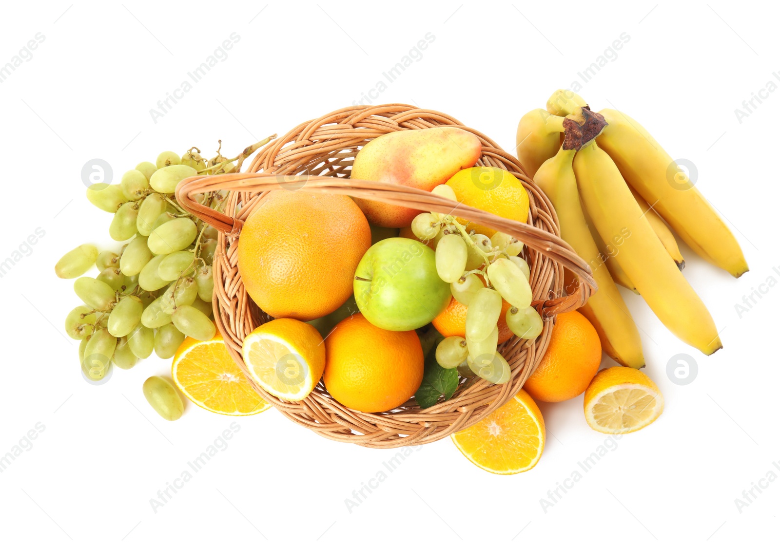 Photo of Wicker basket with different fruits on white background, top view