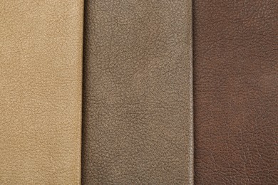 Photo of Different natural types of leather as background, top view