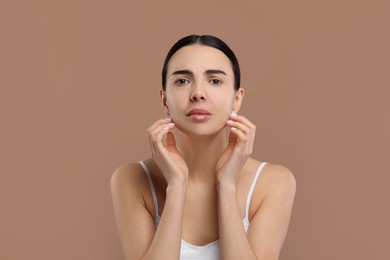 Woman with dry skin on beige background