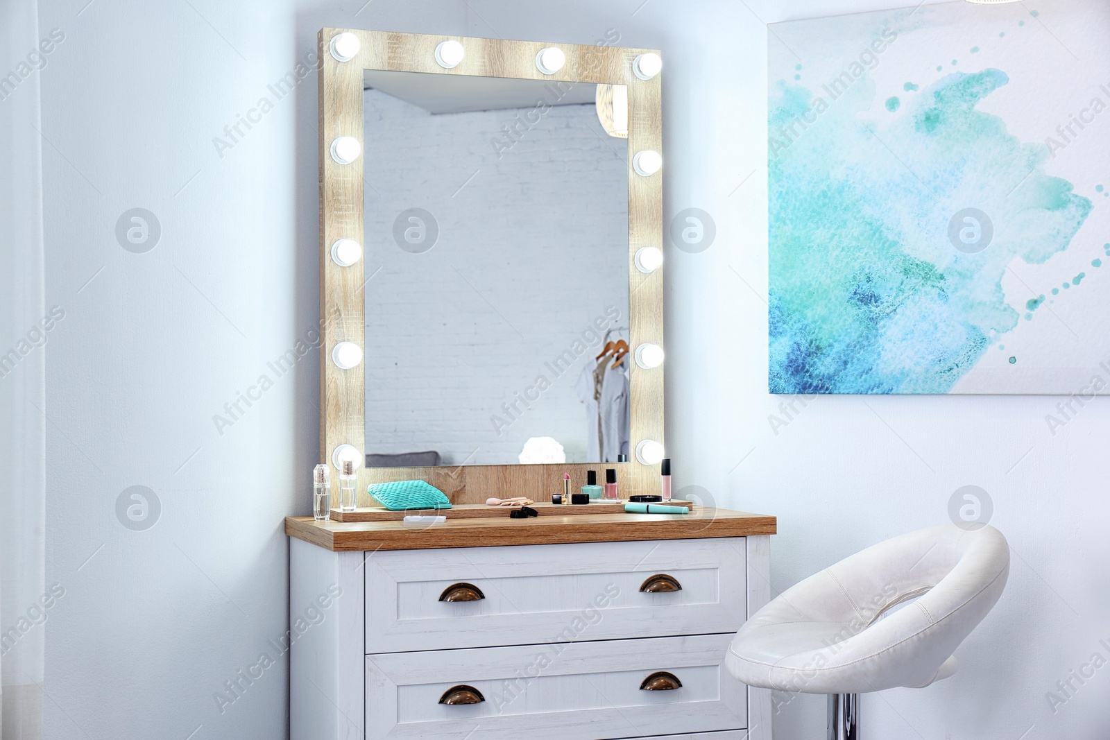 Photo of Dressing room interior with makeup mirror and table