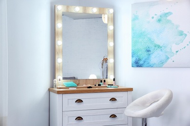 Dressing room interior with makeup mirror and table