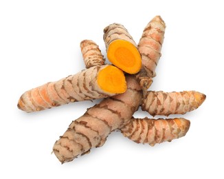 Fresh whole and cut turmeric roots isolated on white, top view