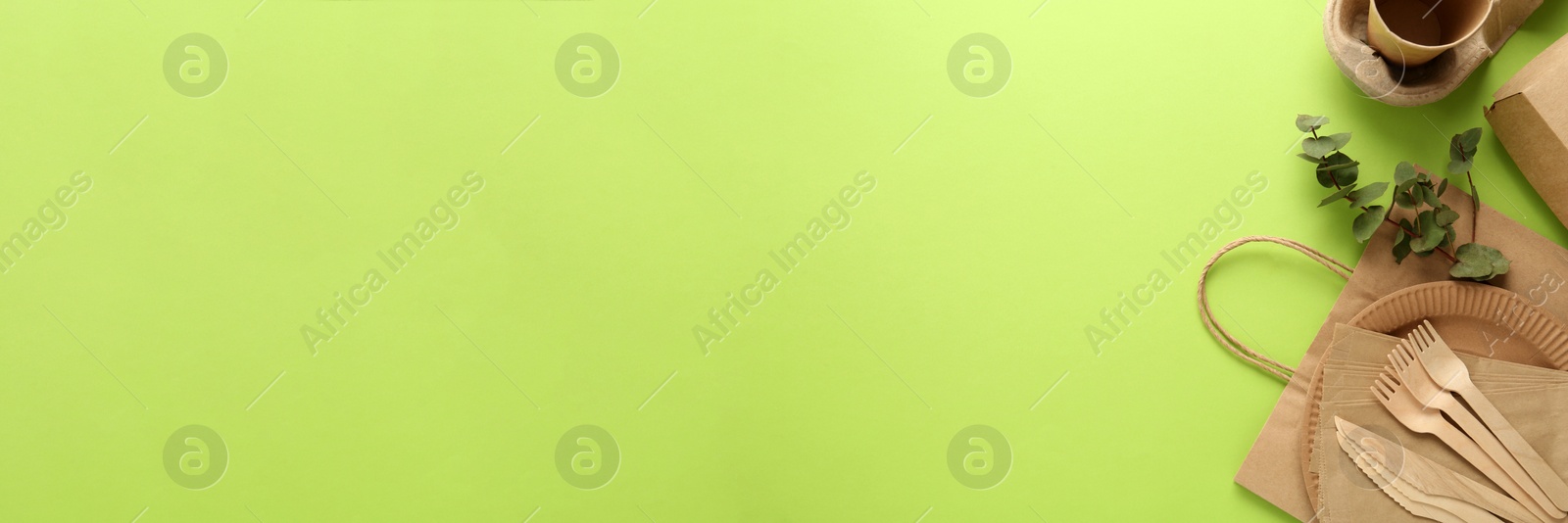 Image of Flat lay composition with eco friendly products on light green background, space for text. Banner design