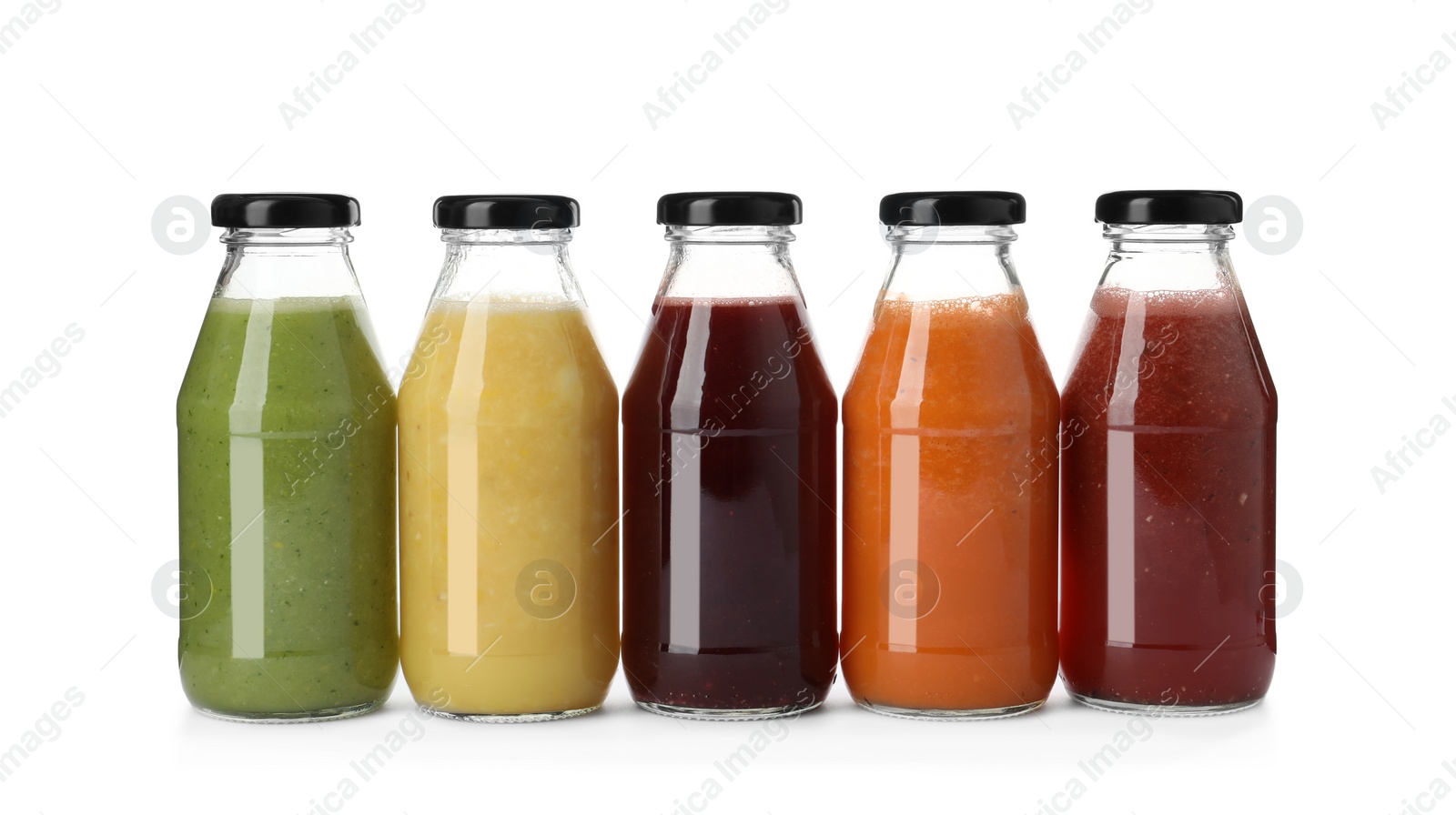 Photo of Bottles of fresh juices on white background