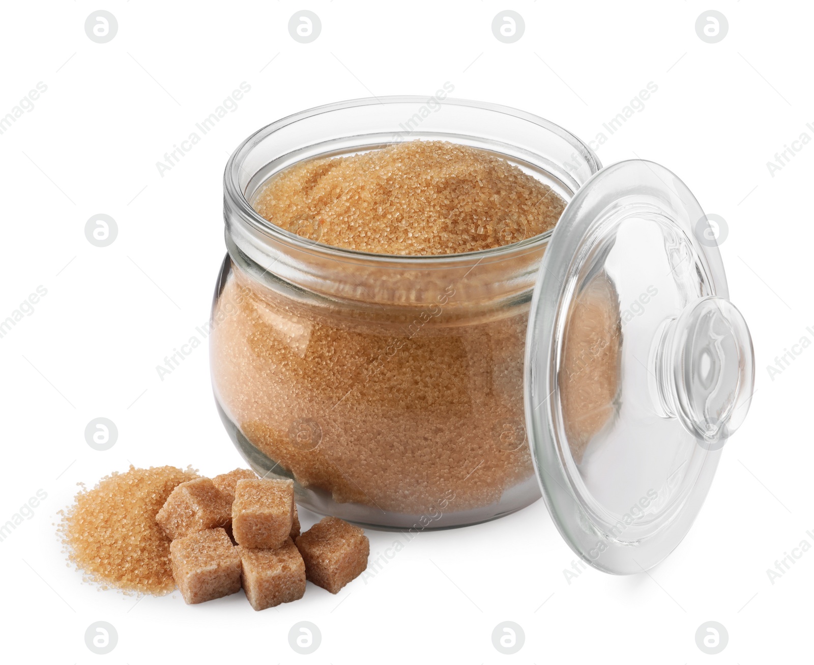 Photo of Granulated and cubed brown sugar with jar on white background