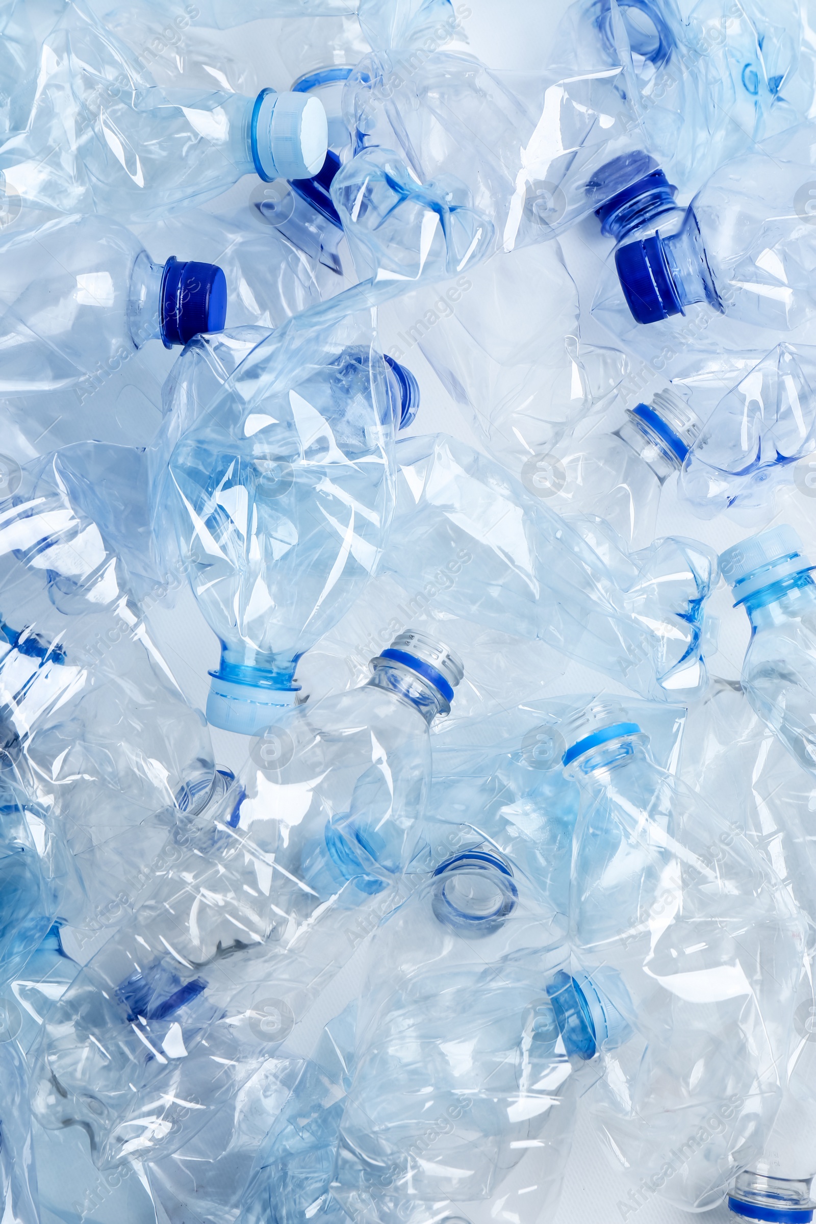 Photo of Many used plastic bottles as background, top view. Recycling problem