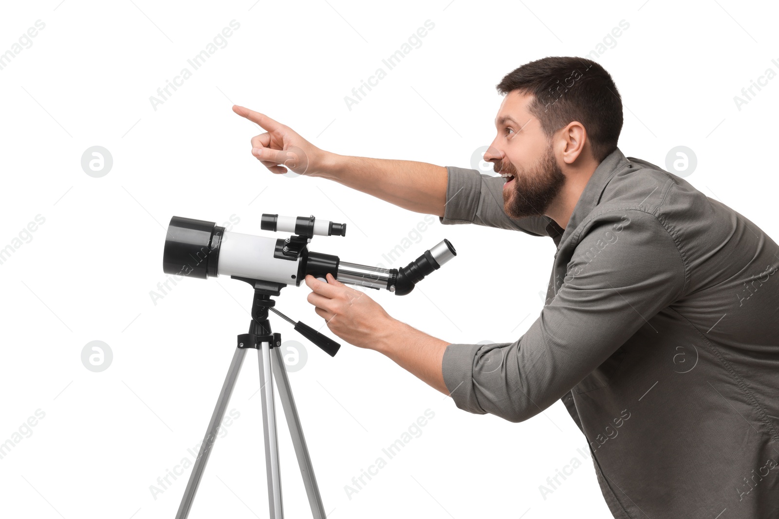 Photo of Excited astronomer with telescope pointing at something on white background