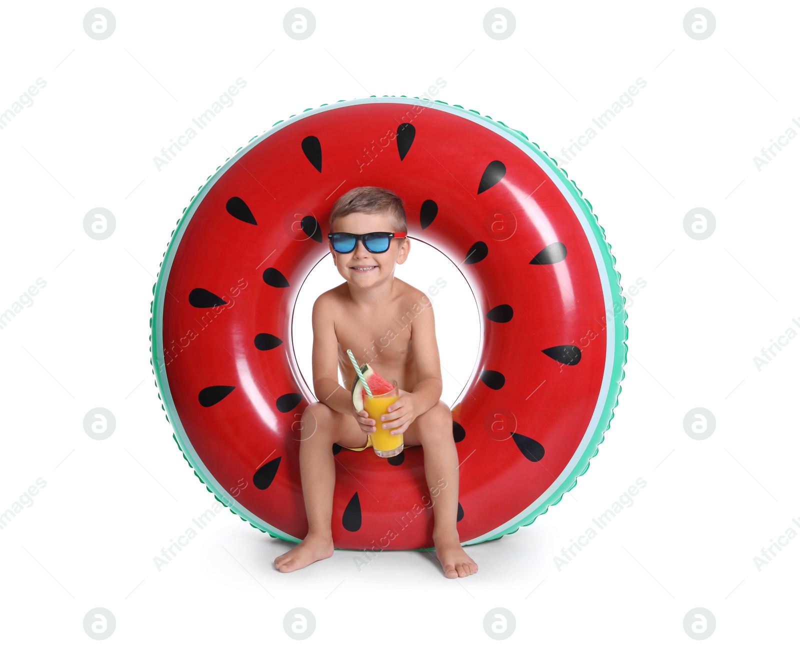 Photo of Cute little boy with inflatable ring and glass of cocktail on white background