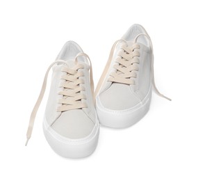 Photo of Pair of stylish beige sneakers isolated on white