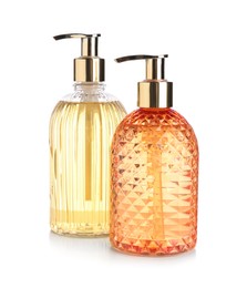 Stylish dispensers with liquid soap on white background