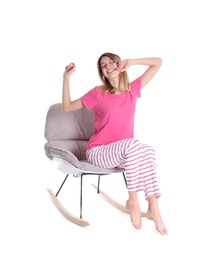 Young woman relaxing in armchair on white background