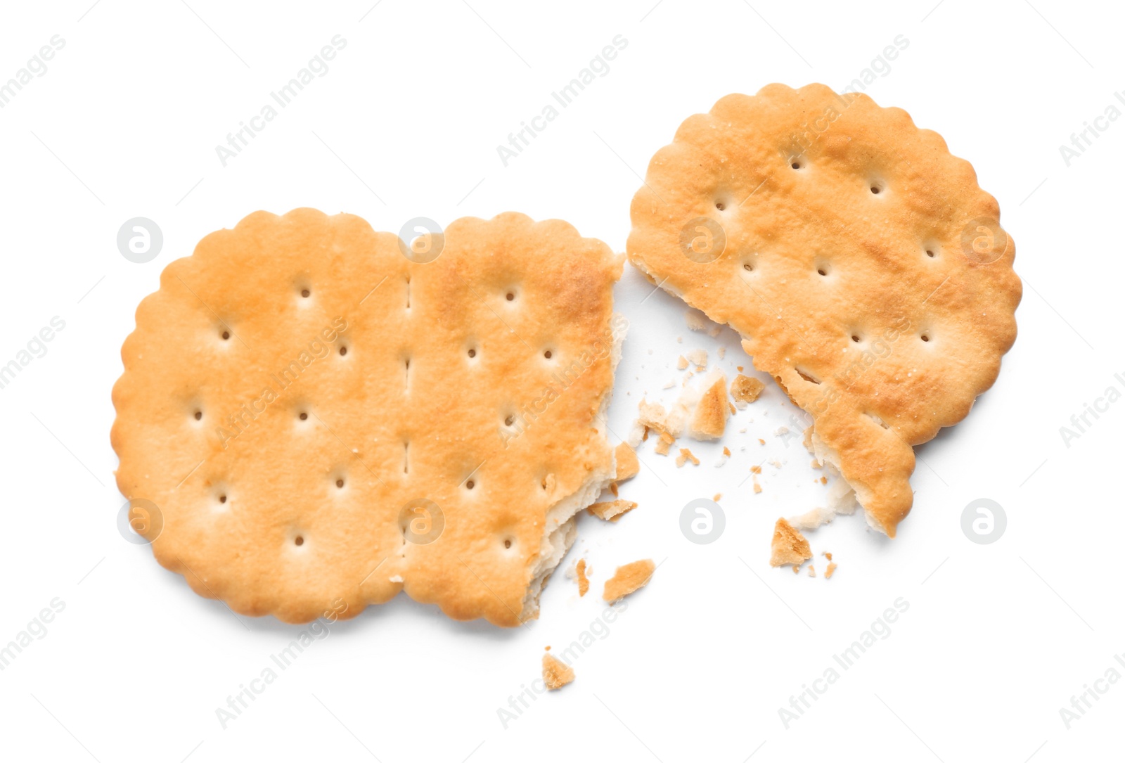 Photo of Broken delicious crispy cracker isolated on white, top view