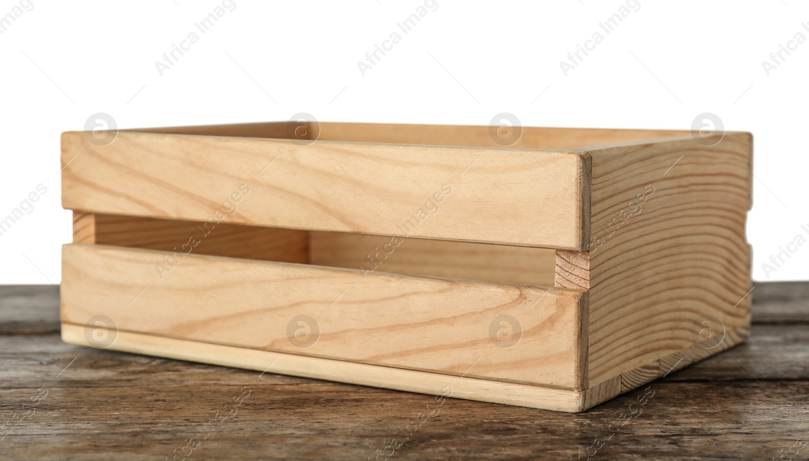 Photo of Empty rustic wooden crate on table against white background