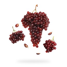 Image of Fresh grapes in air on white background