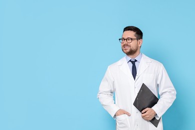 Doctor with clipboard on light blue background, space for text