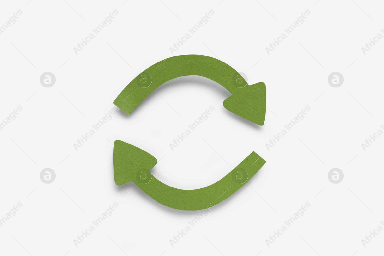 Photo of Paper curved arrows on white background, top view. Space for text